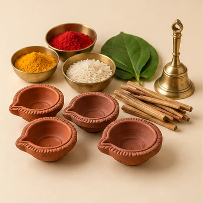 Clay diyas and neatly arranged puja essentials